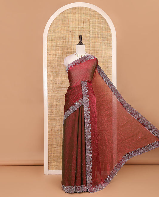 Maroon Swarovski crystal stone embedded fendy chiffon saree, scallop border accentuated with floral and scallop design in Swarovski stones