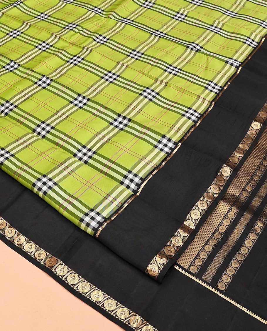 Green-Black Vasundhara Lite Silkmix Saree Features Checks, Contrast Rettai Pettu Rekku-Poun Border, Zari-Striped Pallu, and a Contrast Blouse