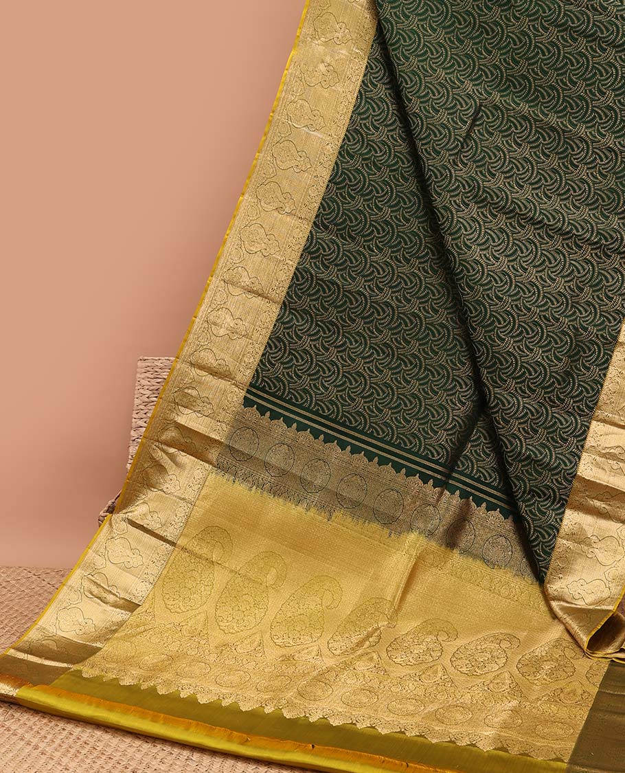 Green geometric design kancheepuram silk saree with contrast floral zari border & pallu of paisley design