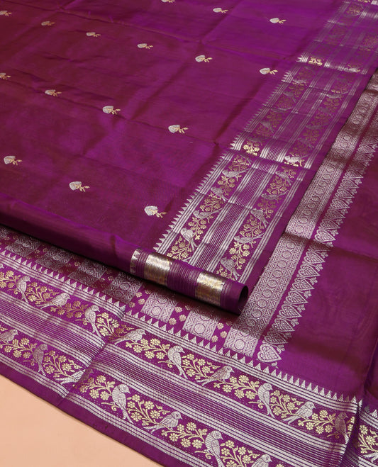 Purple Venkatagiri Silk Saree, Decorated with Zari Buttas on Its Body, Highlighted by a Traditional Zari Border of Floral-Sparrow Designs, Pallu Steeped with Traditional Designs, and Paired with a Matching Blouse