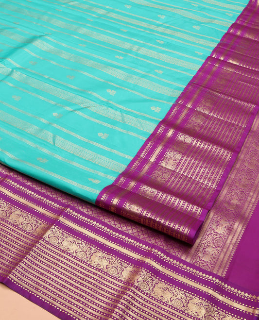 Blue Vasundhara Silk Saree, Embellished with Zari Designs All Over Its Body, Complemented by a Contrast Korvai Border of Thilakam Mokku, Muthu, and Yaali Designs, Grand Jaal Pallu, and Paired with a Contrast Blouse