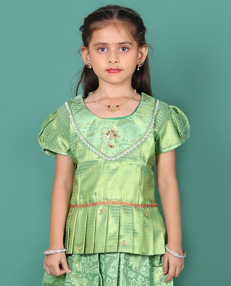 Green readymade art silk pavadai set, floral jaal jacquard with traditional zari border skirt, jacquard embroidered puff-sleeve blouse