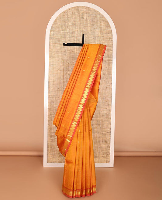 Orange buttas kancheepuram silk saree with contrast border of banaras, checked design & zari design pallu