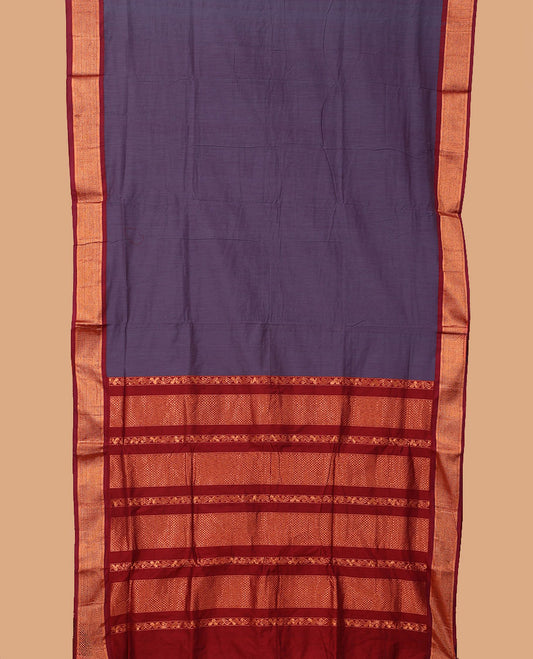 Purple plain nine-yard cotton saree, contrast traditional zari border, and pallu of traditional designs