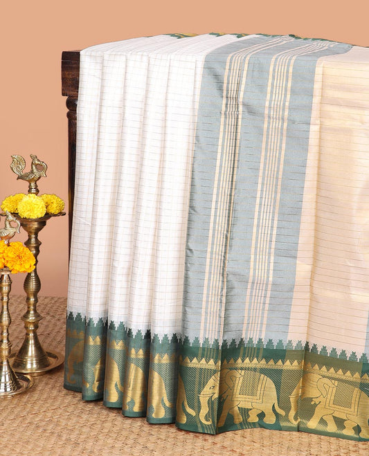 White zari checked design dola silk saree with contrast elephant design border & chit pallu along with checked design blouse