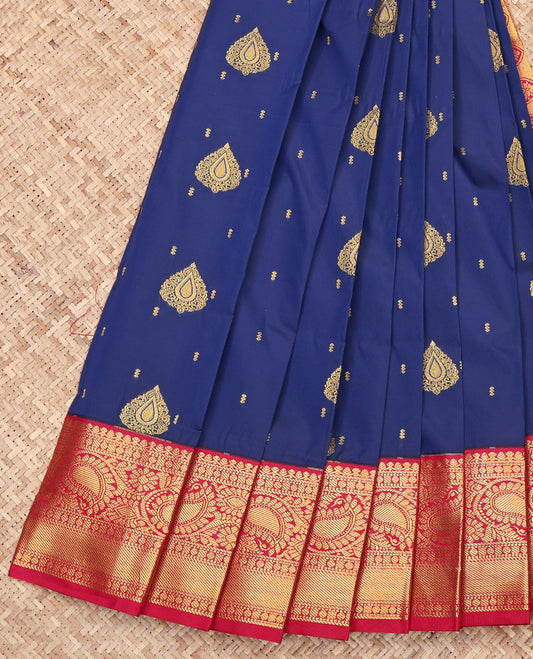 Navy Blue Budget Silk Saree, Adorned with Zari Buttas on Its Body, Complemented by a Contrast Traditional Zari Border of Paisleys, Intricately Designed Pallu, and Paired with a Contrast Blouse