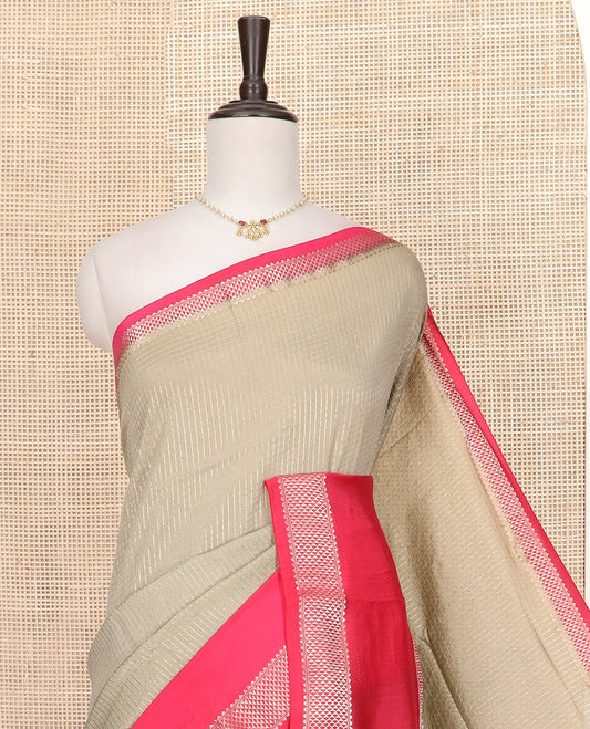 Grey Assam Silk Saree Gleamed Up with Zari Checks, Complemented by Contrast Zari Border of Triangle Motifs, a Gleaming Pallu of Zari Stripes, and Paired with a Contrast Blouse