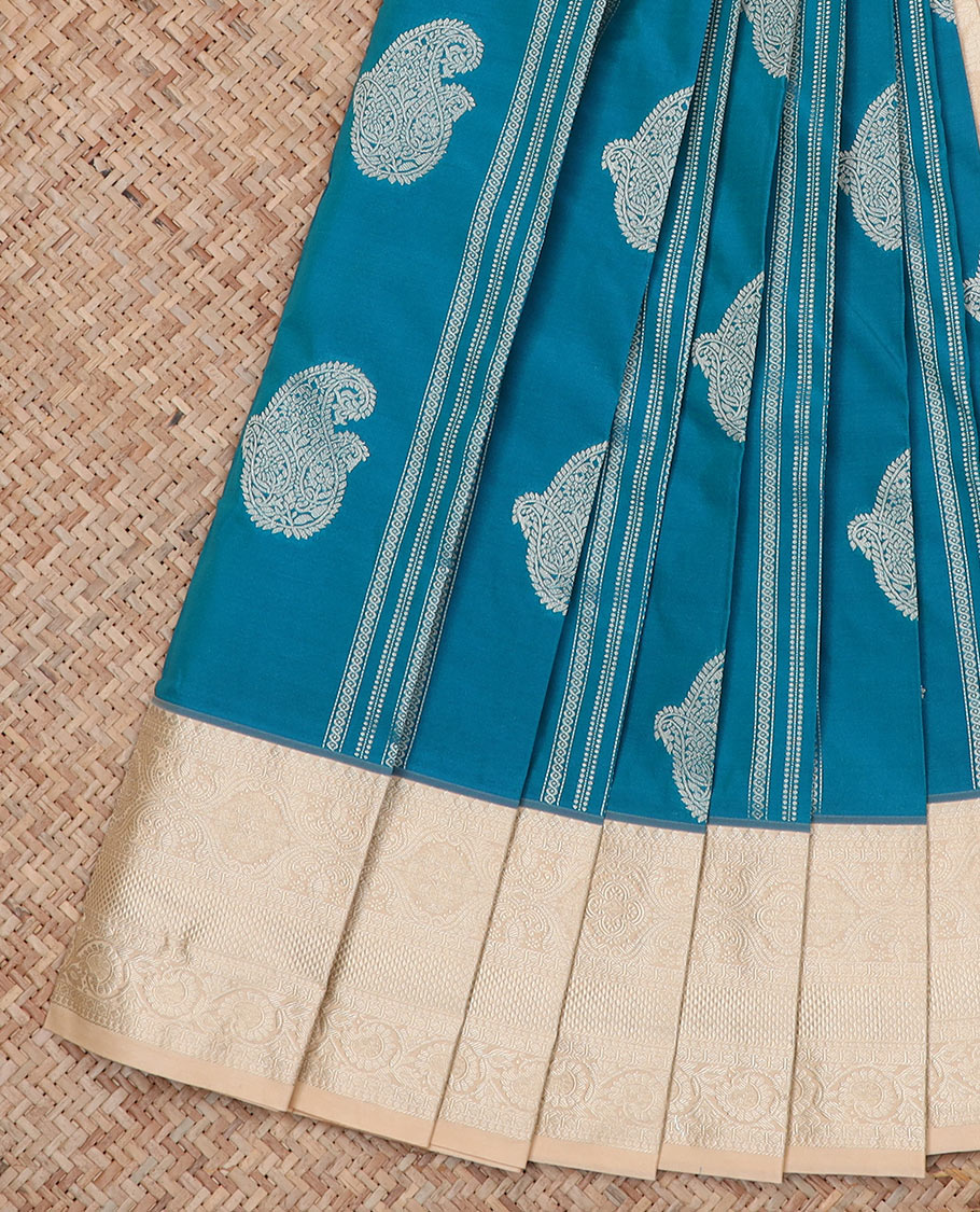 Blue Budget Silk Saree Adorned with Paisley Zari Buttas, Complemented by a Contrast Traditional Zari Border, a Zari-Design Detailed Pallu, and a Contrast Zari-Bordered Blouse