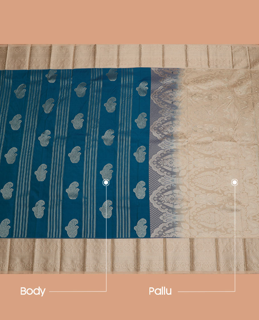 Blue Budget Silk Saree Adorned with Paisley Zari Buttas, Complemented by a Contrast Traditional Zari Border, a Zari-Design Detailed Pallu, and a Contrast Zari-Bordered Blouse