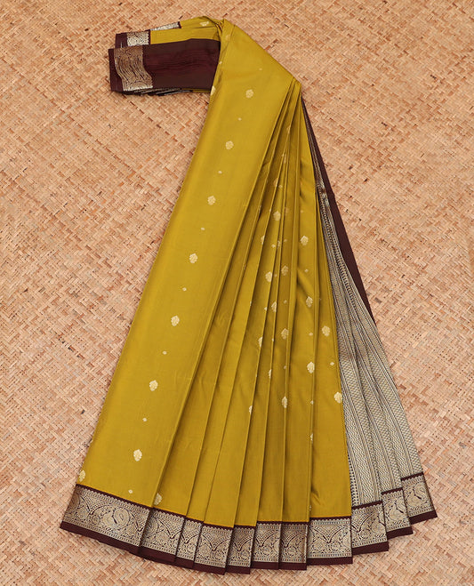 Green Budget Silk Saree Simply Sparkled with Buttas, Highlighted with a Contrast Peacock Zari Border, Pallu of Geometric Design, and Paired with a Contrast Blouse