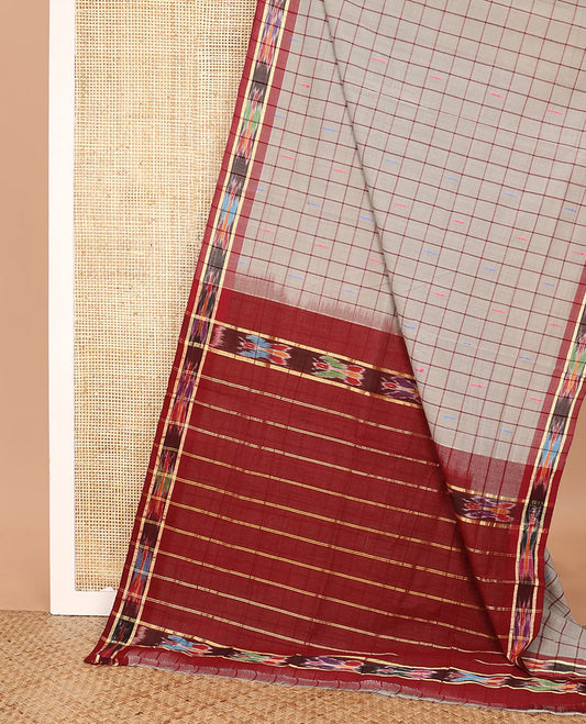 Grey butta enclosed checked Andhra cotton saree, contrast ikkat border, and pallu of zari stripes