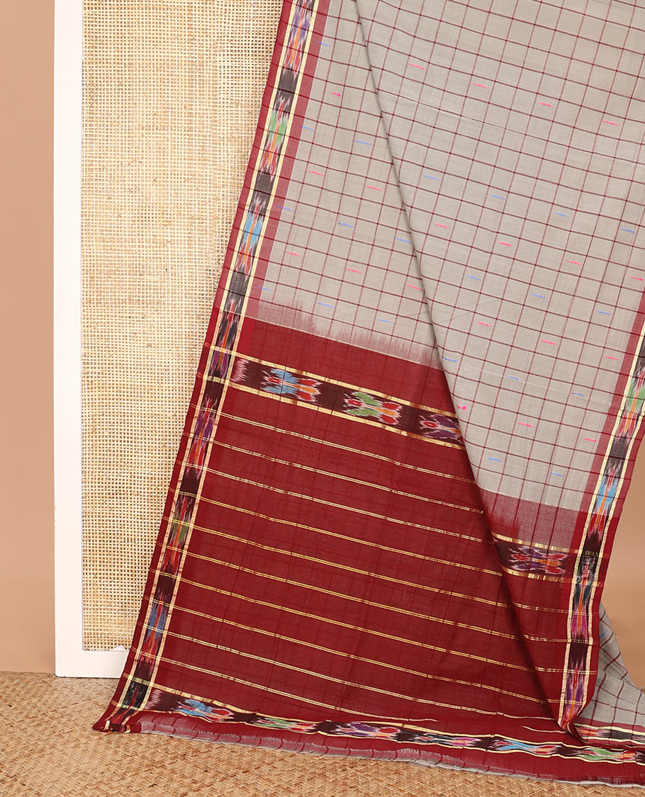 Grey butta enclosed checked Andhra cotton saree, contrast ikkat border, and pallu of zari stripes