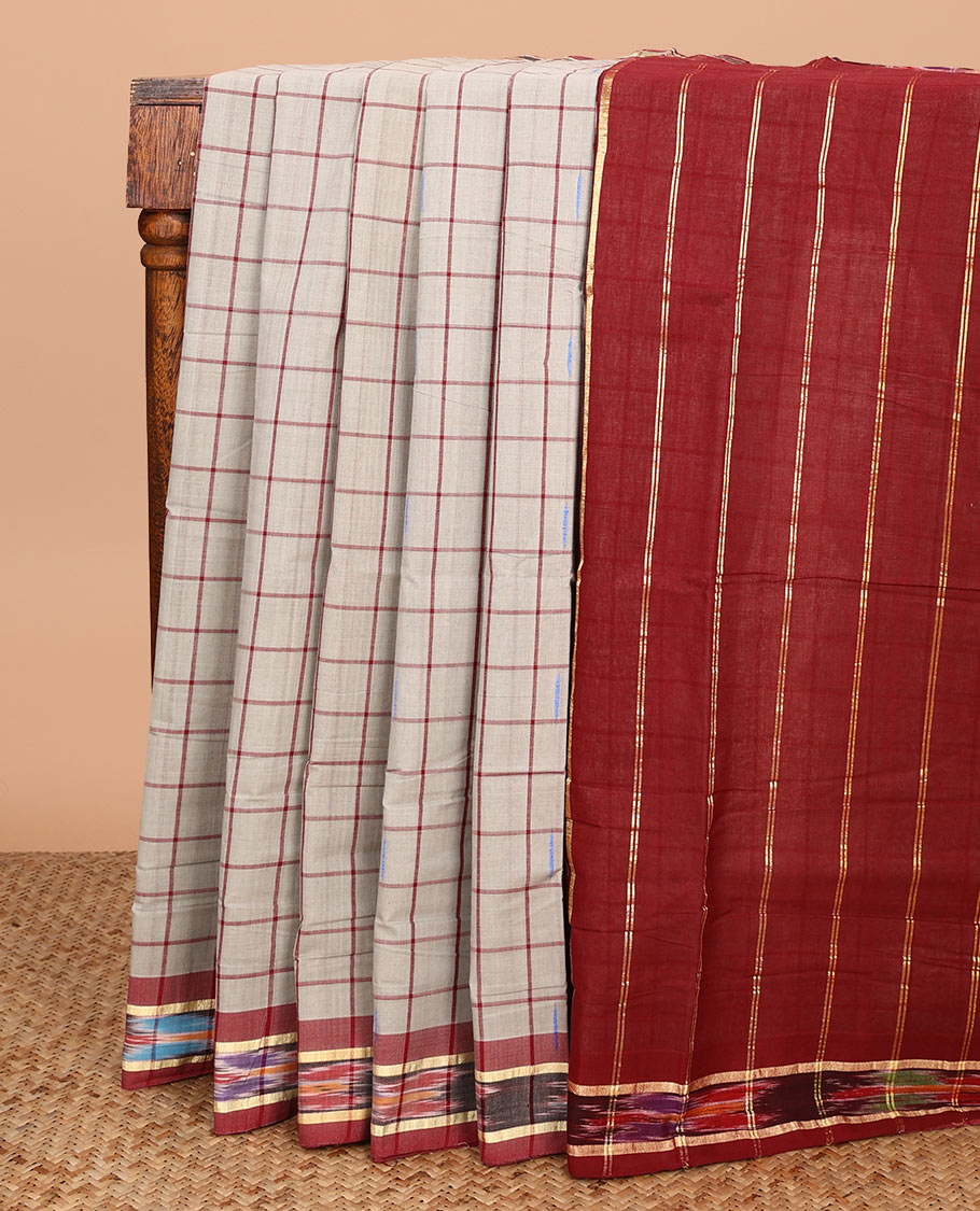 Grey butta enclosed checked Andhra cotton saree, contrast ikkat border, and pallu of zari stripes