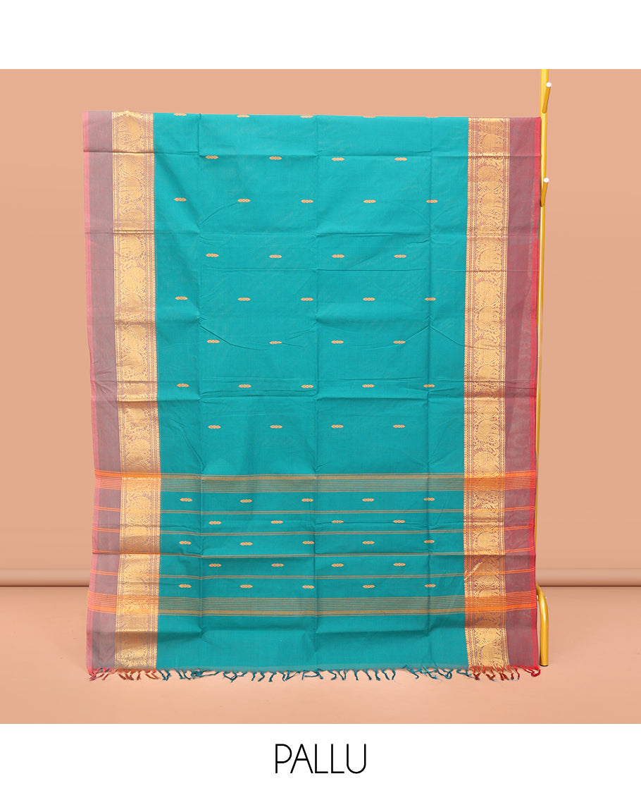 Blue Chettinad Cotton Saree, Bedecked with Thread Buttas All Over Its Body, Complemented by a Contrast Kal Eragina Border of Kodi Peacock and Elephant Designs, Pallu of Buttas and Stripes, and Paired with a Matching Blouse