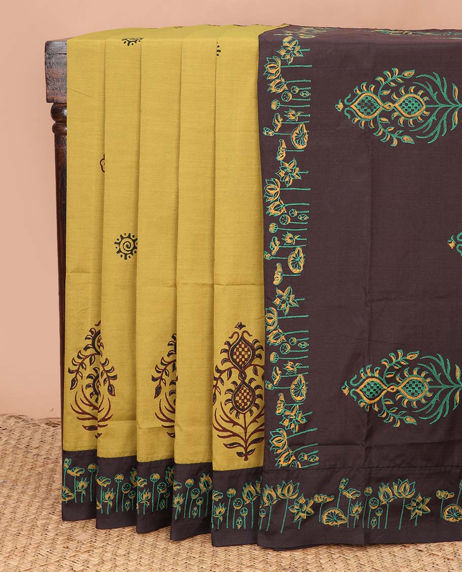 Yellow unique motifs printed poly cotton saree, contrast floral motif block printed border, and block printed motif pallu