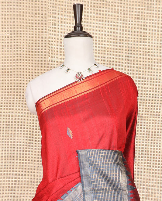 Red Dupion Silk Saree Featuring Geometric Buttas All Over Its Body, Highlighted by a Contrast Temple Border of Checked Patterns, Pallu Steeped with Zari Stripes, and Paired with a Contrast Blouse