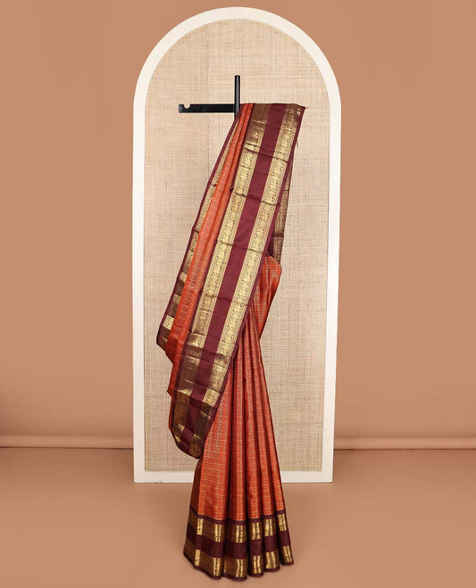 Orange zari checked Kanchipuram silk saree, contrast rettai pettu border of rekku, banaras, neli, and mayil chakram designs, and pallu of lavangam designs