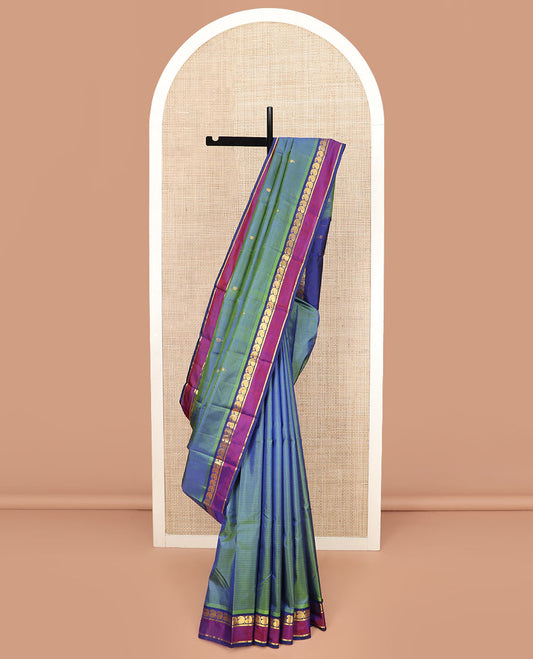 Green Striped Kanchipuram Silk Saree with Zari Buttas, Complemented with Contrast Rettai Pettu Border Features Manga and Kathir Designs, Pallu Subtly Woven with Zari Buttas, and Paired with a Contrast Blouse