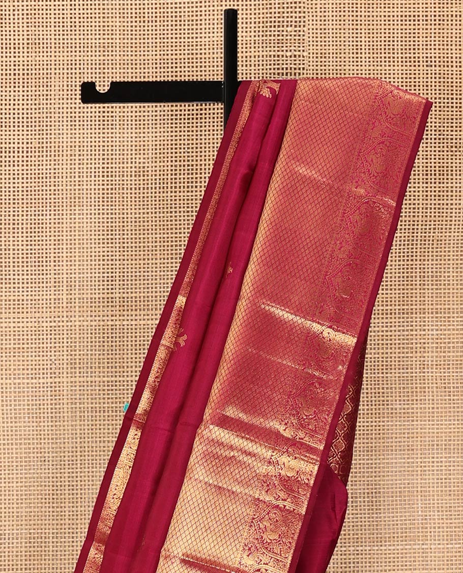 Purple Kanchipuram Silk Saree, Meticulously Crafted with Zari Buttas All Over Its Body, Highlighted by a Zari Border of Rekku, Paisa, Mayil, and Jaal Designs, Pallu of Ogee Patterns, and Paired with a Matching Blouse