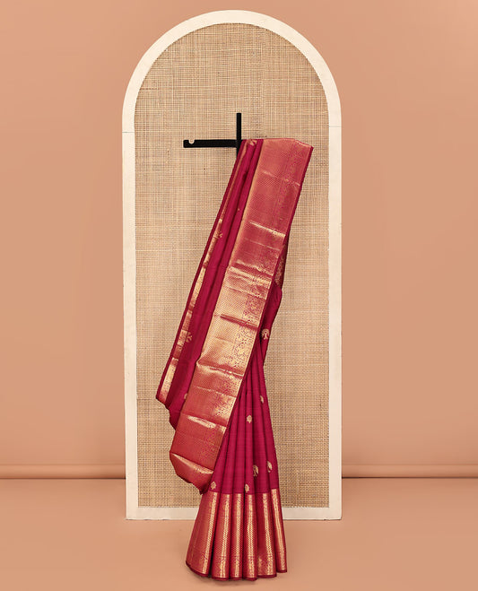 Purple Kanchipuram Silk Saree, Meticulously Crafted with Zari Buttas All Over Its Body, Highlighted by a Zari Border of Rekku, Paisa, Mayil, and Jaal Designs, Pallu of Ogee Patterns, and Paired with a Matching Blouse