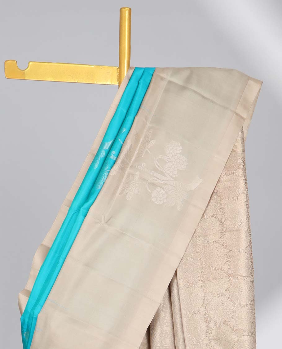 Blue floral buttas soft silk saree with contrast zari design border & round buttas pallu