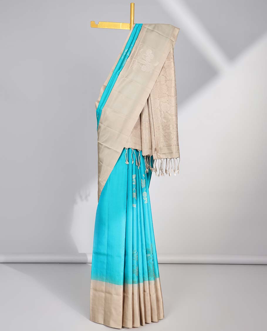 Blue floral buttas soft silk saree with contrast zari design border & round buttas pallu