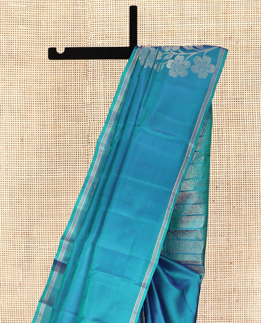 Borderless Blue Mayuri Lite Silk Mix Saree, Subtly Accented with Floral Zari Buttas All Over Its Body, Highlighted by a Pallu of Geometric Designs, and Paired with a Matching Blouse