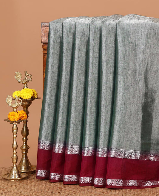 Green plain design Tissue silk saree, contrast traditional zari border of bentex design & lined pallu with tassels