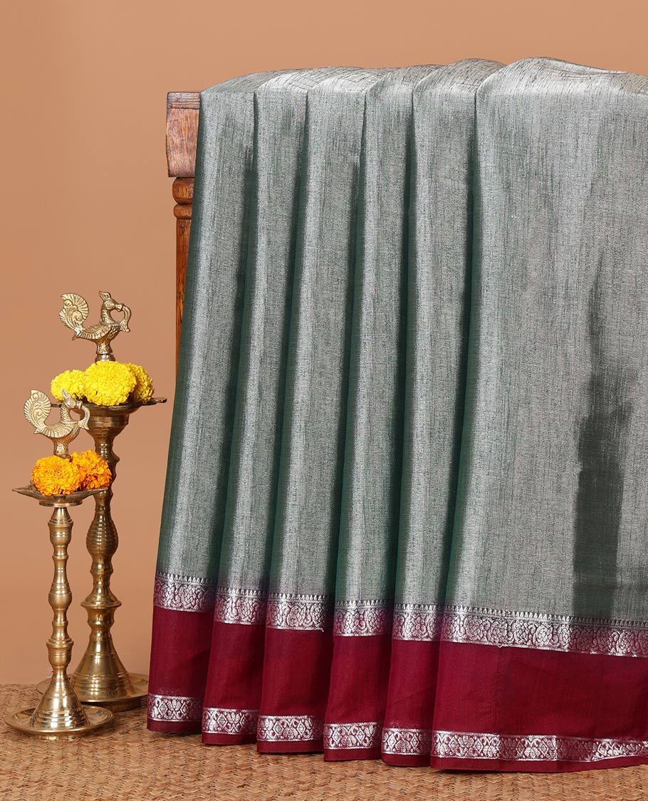 Green plain design Tissue silk saree, contrast traditional zari border of bentex design & lined pallu with tassels