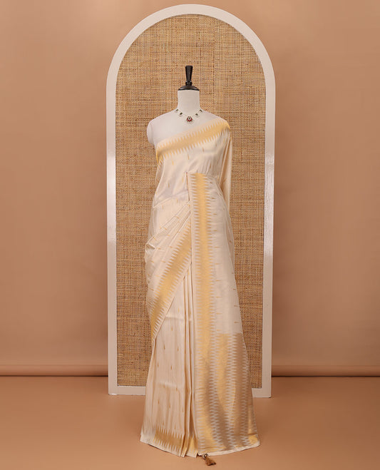 Cream thilakam motifs banarasi tissue saree, zig-zag gold zari border, zig-zag zari design pallu & running blouse