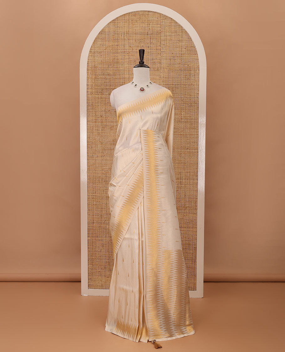 Cream thilakam motifs banarasi tissue saree, zig-zag gold zari border, zig-zag zari design pallu & running blouse