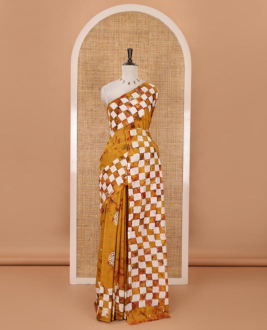 Mustrad shibori dyed & batik printed mul-mul cotton saree, pasapali-checked batik printed border & pallu, & matching shibori & batik print blouse