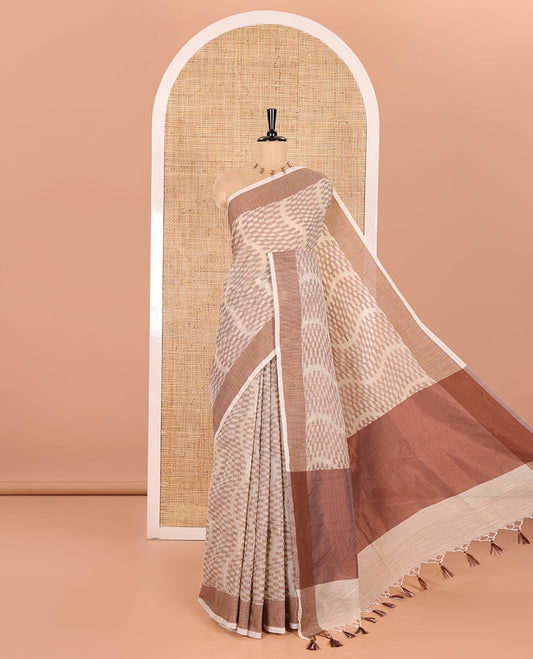 Chikku and Coffee Kota Cotton Saree Subtly Woven with Zig-Zag Checks in Thread, Subtly Sparkled Contrast Bavanji Border, Plain Pallu, and Paired with a Matching Blouse