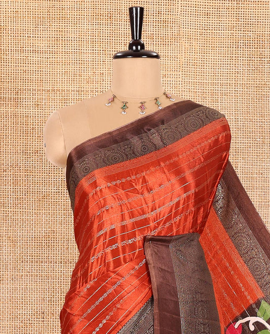 Rust Orange Turkey Crepe Saree Featuring Horizontal Stripes All Over Its Body, Complemented by Contrast Traditional Patterned Border, Vibrant Pallu of Colorful Kalamkari Floral and Peacock Prints, and Paired with a Contrast Blouse