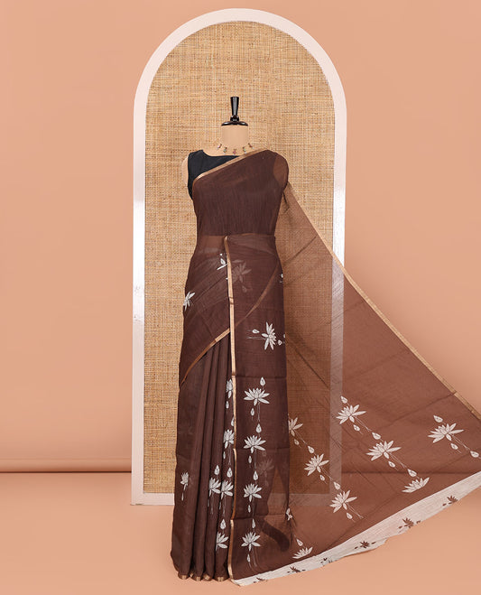 Brown Linen Cotton Saree, Accentuated with Pichwai Lotus Motifs Print, Subtle Piping Border, Pallu Mirrors the Same Pichwai Lotus Print, and Paired with a Contrast Pichwai Lotus Printed Blouse