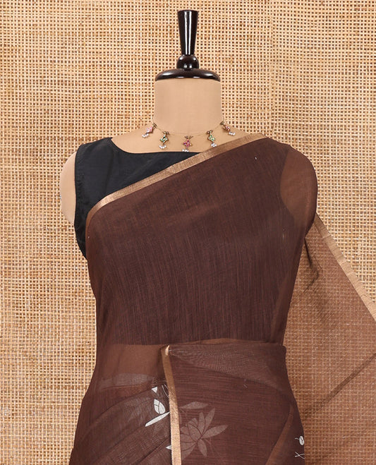 Brown Linen Cotton Saree, Accentuated with Pichwai Lotus Motifs Print, Subtle Piping Border, Pallu Mirrors the Same Pichwai Lotus Print, and Paired with a Contrast Pichwai Lotus Printed Blouse