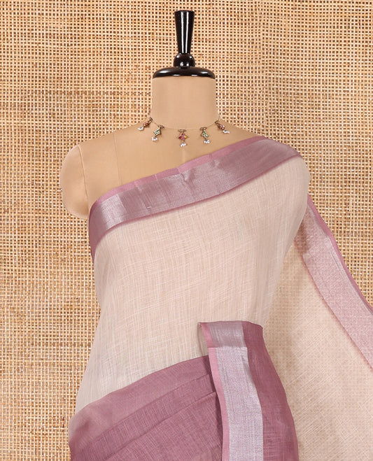 Cream and Purple Plain Linen Cotton Saree, Subtly Ombre-Style Dual-Color Dye on Its Body, Subtle Bavanji Zari Border, Pallu Features Rangoli-Style Patterns Print, and Paired with a Polka Dots Printed Blouse