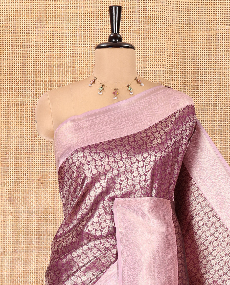 Purple Kanchi Silk Saree, Gleamed Up with Floral-Leaf Jacquard Design on Its Body, Complemented by a Contrast Traditional Zari Design Border, Intricately Designed Pallu, and Paired with a Contrast Blouse