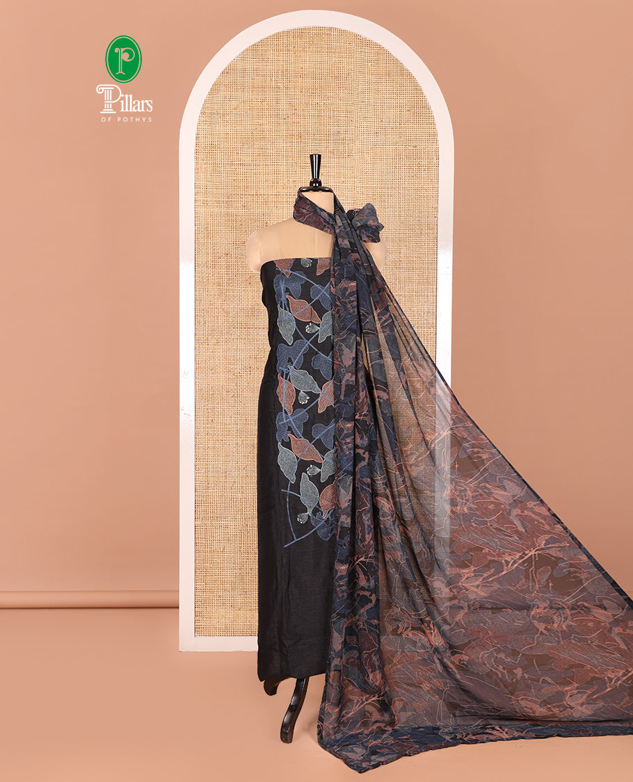 Black Vichitra Silk Designer Material Chudidar Set, Elegantly Embellished with Floral Cross-Stiched Embroidered Top, A Subtly Plain Santoon Bottom, and Paired with a Georgette Abstract Printed Dupatta