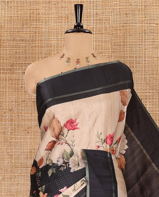 Black floral printed fancy tussar saree, contrast small zari border, and zari design pallu, and a contrast floral printed blouse