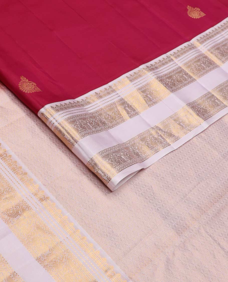 Red zari buttas Vasundhara silk mix saree, contrast border rettai pettu of thilakam, muthu, cross kamalam, neli, and mayil designs, and intricate pallu