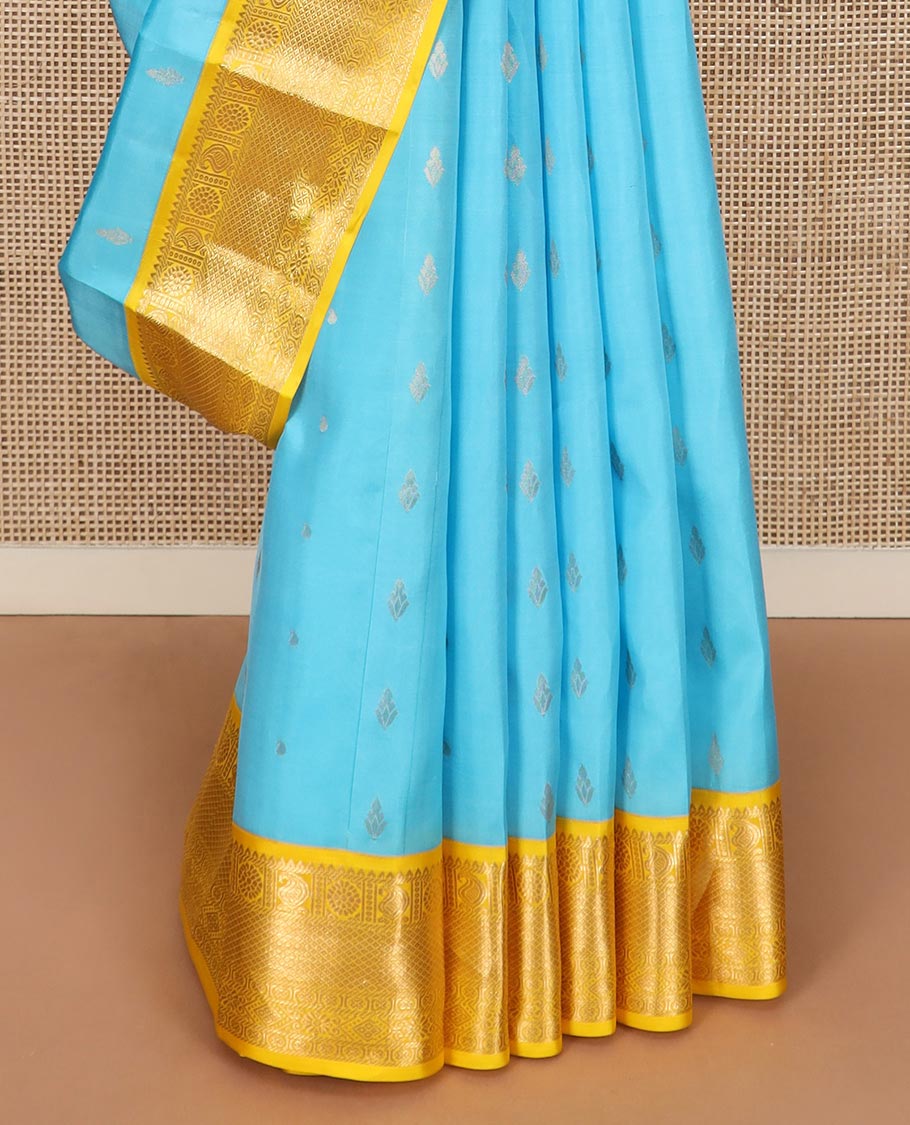 Blue zari buttas Vasundhara silk saree, contrast border of rekku, manga, chakram, mayil kann, and rudraksham designs, and intricate pallu