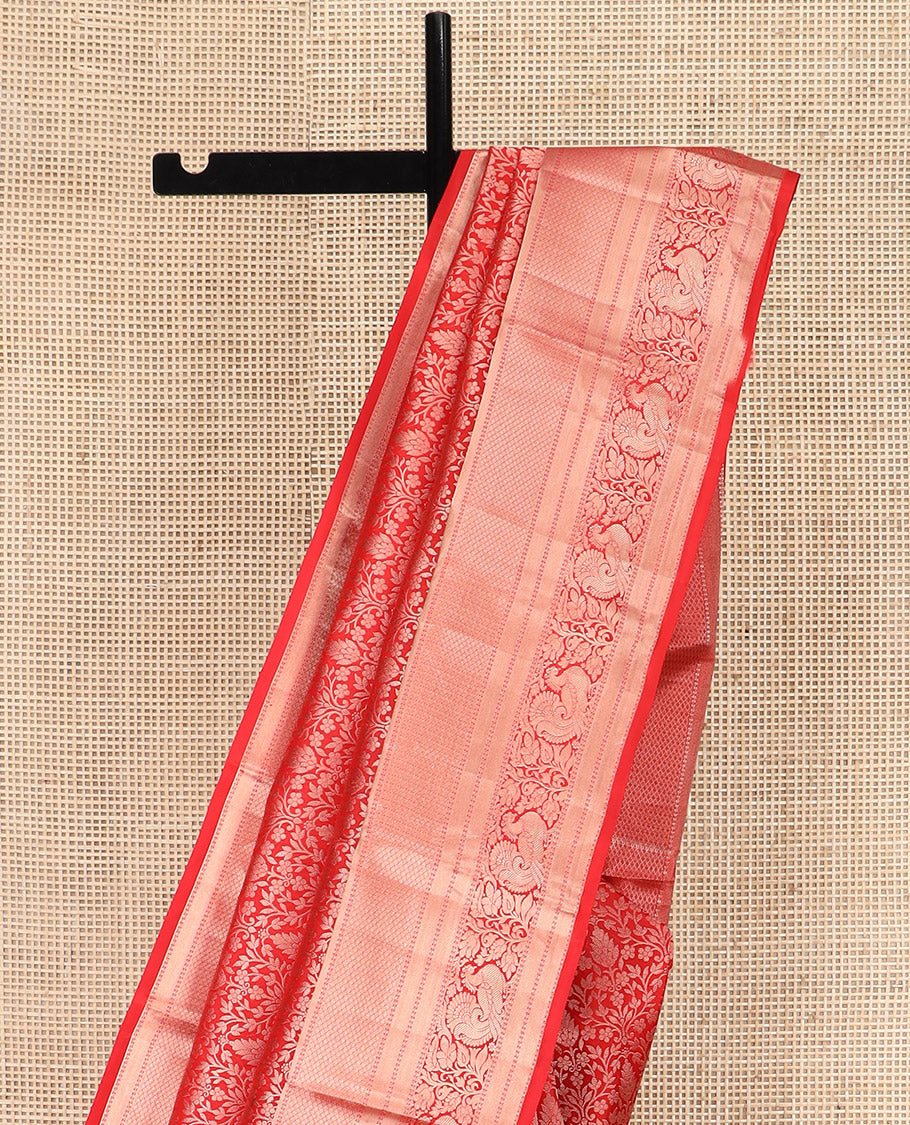 Red Kanchipuram Silk Saree Meticulously Designed with Floral Jaal Jacquard Design, Highlighted by Zari Border of Thilakam, Mayil Kann, Neli, and Mayil Designs, Gracefully Embellished Pallu, and Paired with a Matching Blouse