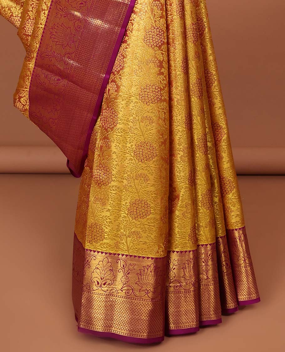 Yellow floral design kancheepuram silk saree with contrast floral zari border & ogee zari design pallu