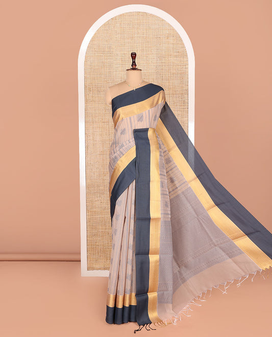 Light Sandal Semi-Silk Cotton Saree, Finely Woven with Buttas and Stripes All Over Its Body, Complemented by a Contrast Border of Traditional Zari Designs, Pallu of Jaal Designs, and Paired with a Matching Blouse