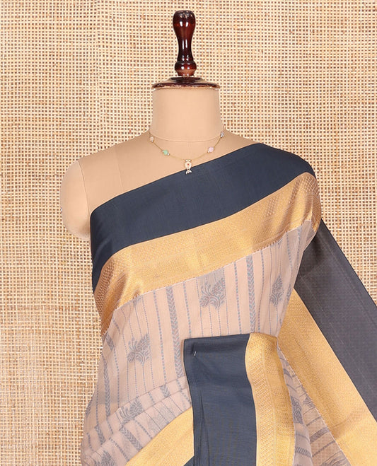 Light Sandal Semi-Silk Cotton Saree, Finely Woven with Buttas and Stripes All Over Its Body, Complemented by a Contrast Border of Traditional Zari Designs, Pallu of Jaal Designs, and Paired with a Matching Blouse