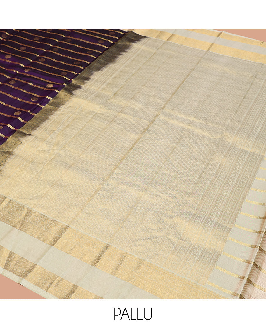Purple Vasundhara Silk Saree Spotlighted with Zari Buttas and Zari Stripes All Over Its Body, Complemented by Contrast Rettai Pettu Border of Round Mayil Designs, a Grand Pallu, and Paired with a Contrast Blouse