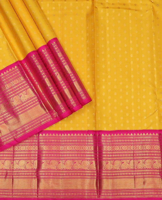 Yellow pure silk half saree, kamalam buttas skirt, contrast border, and blouse of rekku,muthu,kathir,chakram,mayil and kuyil kann, and zari checked dhavani