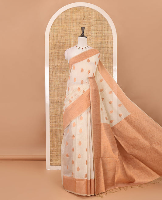 Cream copper zari thilakam motifs woven Tissue chanderi saree, gold zari bavanji border, plain pallu & brocade blouse
