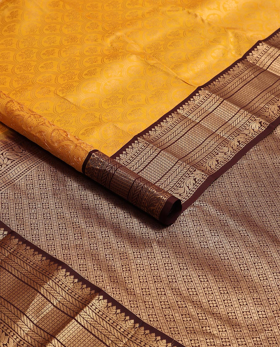 Orange floral jaal design kancheepuram silk saree with contrast border of thilakam mokku, banaras, muthu design & zari design pallu